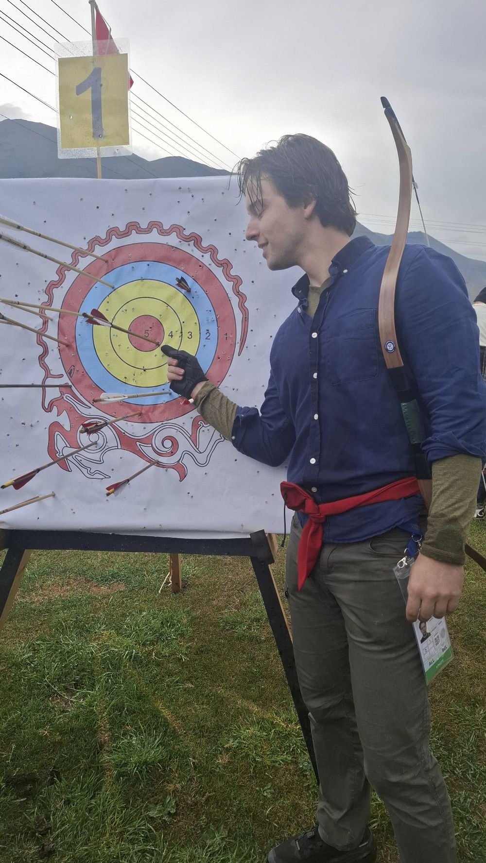 A Belgian archer pointing to his bullseye on the Teke Buta target, World Nomad Games 2026