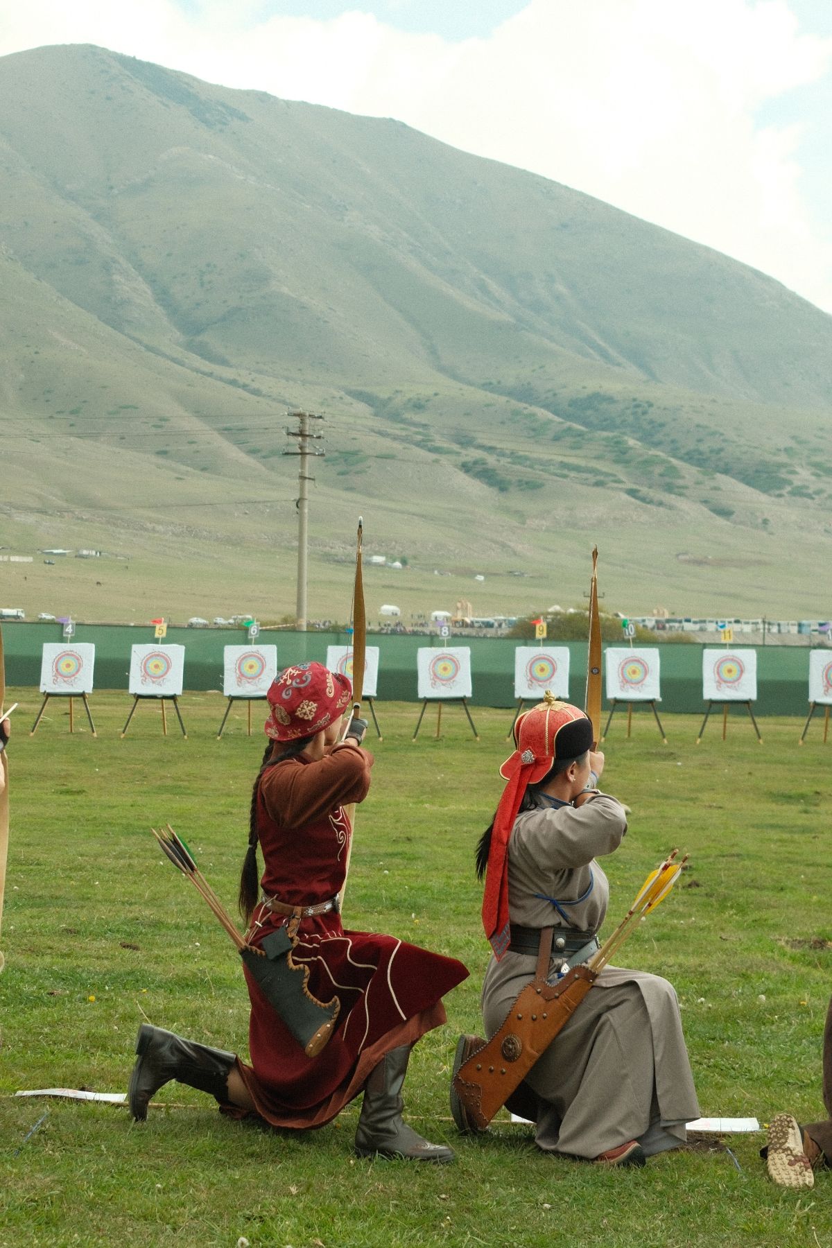 Archers kneeling on the shooting line at the World Nomad Games 2026, Issyk-Kul